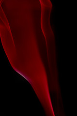 Fototapeta premium single colored smoke aginst black background