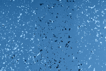 Golden sparkles on turquoise background. Main color trend for 2020 year.