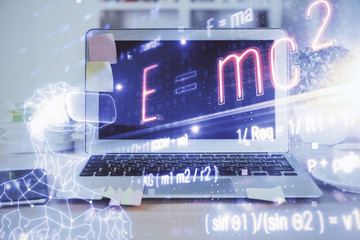 Desktop computer background and formula hologram writing. Double exposure. Education concept.