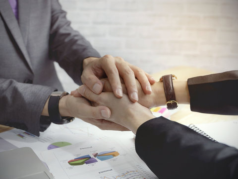 Business trust commitment which Business Partners holding hands with Help, trust ,support ,empathy and factors relationship marketing for reach successful achievement and meeting commit concept.