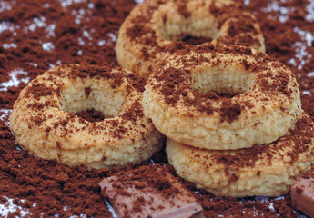 Ring biscuits and chocolate sprinkled with milled coffee.