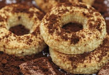 Ring biscuits and chocolate sprinkled with milled coffee.