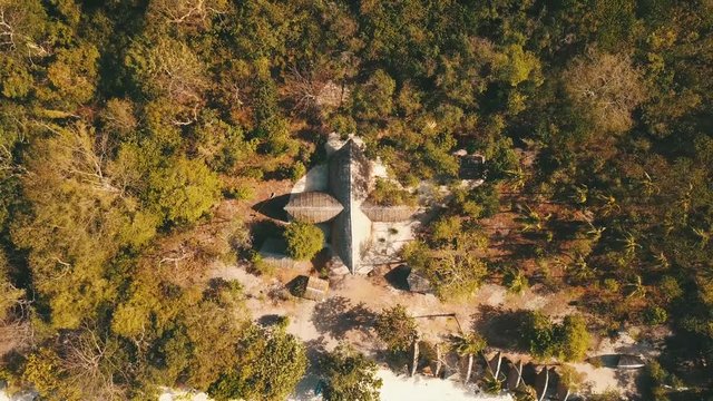 cross styled big bungalow. Flying up from it.