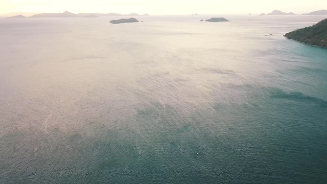 wind trails in the water.m Panoramam over the water in the Philippines. Sunset