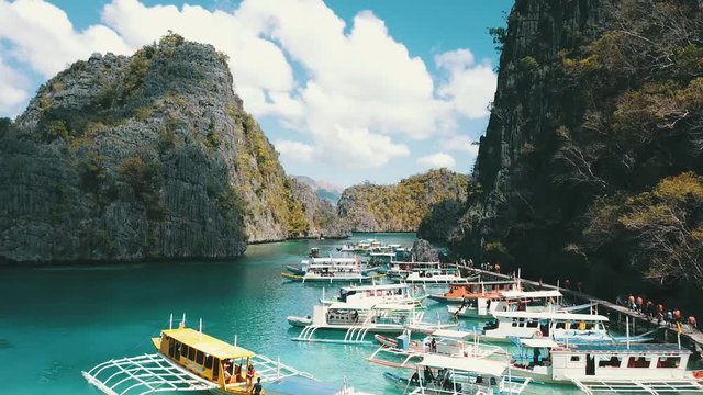 forward flight over many bangka boats at a popular tourist location