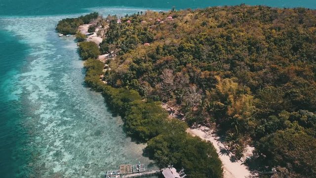 pan up over a island in the ocean