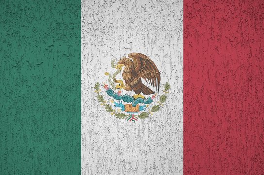 Mexico flag depicted in bright paint colors on old relief plastering wall. Textured banner on rough background