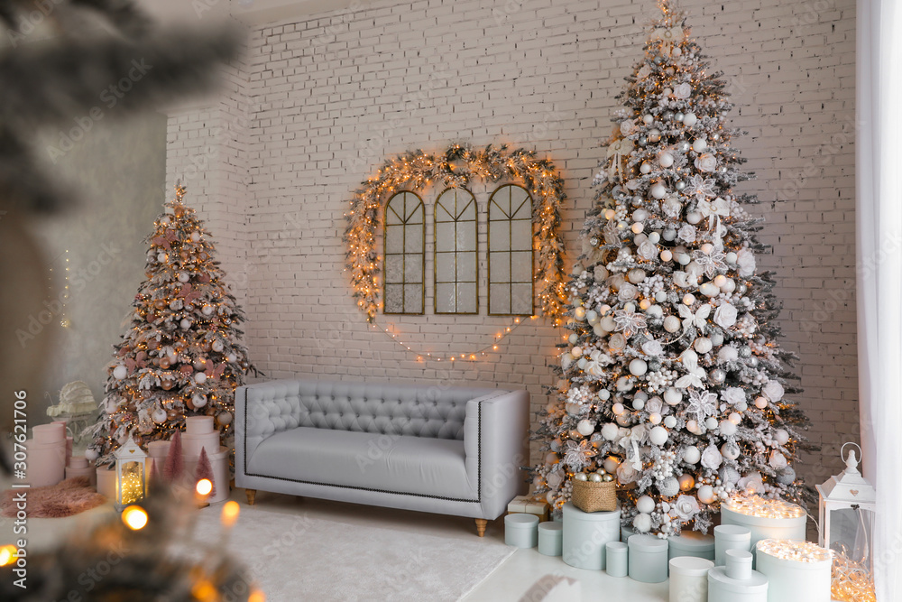 Poster Beautiful interior of living room with decorated Christmas trees