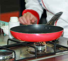 Chef heats the sugar in a pan
