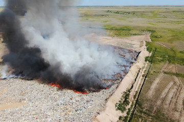 Burning trash. fire at the landfill. Burning garbage.