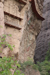 La Shao temple with giant 30-meter Buddha carved into rock at water Curtain Caves in Wushan , Gansu province, China. 