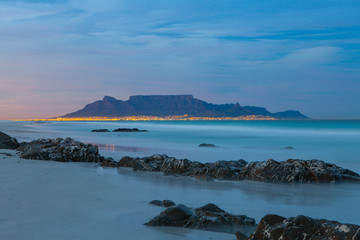 scenic view of table mountain cape town south africa from blouberg with city lights at night