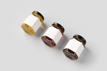Hexagonal honey jars mockup with blank label. Three different colors.