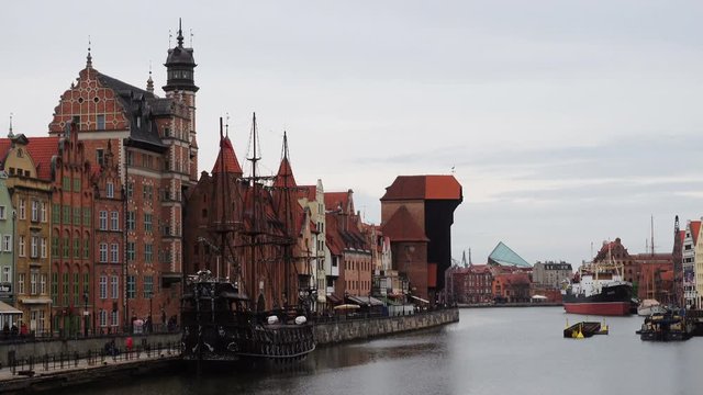 GDANSK, POLAND, MARCH 04, 2019: river Motlawa bank at the center of Gdansk with beautiful buidilngs facades and famous crane