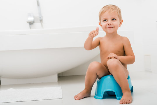 nude toddler girls peeing stock.adobe.com
