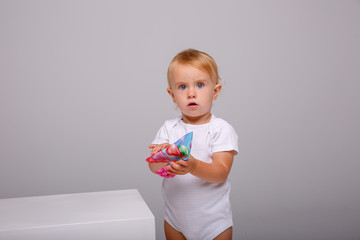 toddler wearing birthday cap on isolated background