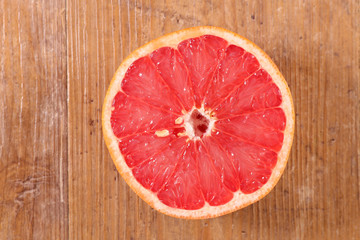 Fototapeta na wymiar pink grapefruit half juicy, top view
