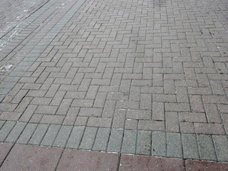 paved red and gray pavers street road