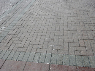 Fototapeta premium paved red and gray pavers street road