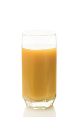 peach juice in a glass isolated on white background