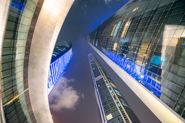 ABU DHABI, UAE - DECEMBER 8, 2016: Downtown buildings at night, wide angle view from the street