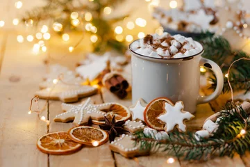  Winter hot drink: white mug with hot chocolate with marshmallow and cinnamon. Cozy home atmosphere, festive holiday mood. Rustic style, wooden background. Homemade gingerbread cookies © ArtSys