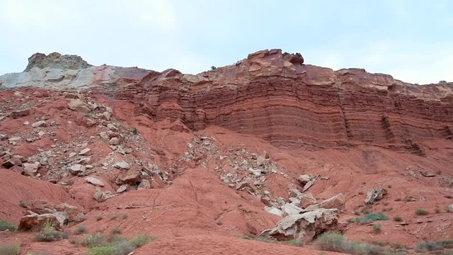 Scenic driving in slow motion Capitol Reef National Monument panning point of view of colorful stone red rock in Utah 