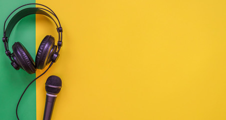 Microphone and headphone on a yellow background