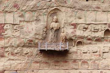 La Shao temple with giant 30-meter Buddha carved into rock at water Curtain Caves in Wushan , Gansu province, China. 