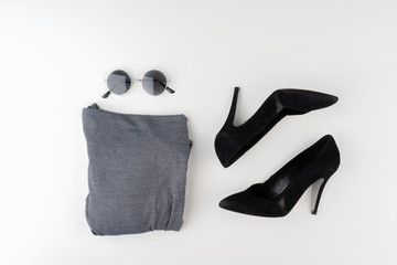 Flat lay of woman summer outfit on white background
