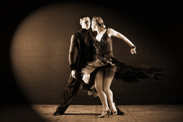 dancers in ballroom isolated on black background