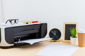 Office printer close up on a wooden table