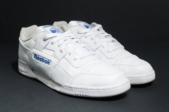 london, england, 05/05/2018 Reebok classic Workout plus Hipster unisex Stone Trainer Size UK 9 on a black stdio background. retro vintage british made shoes.