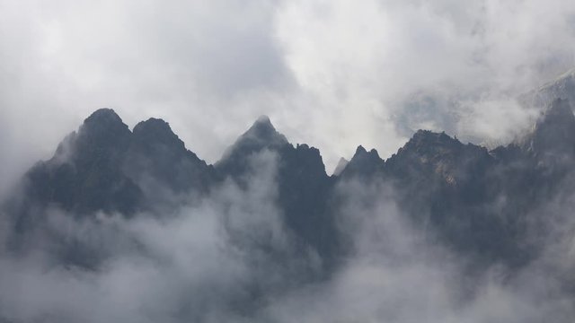 Cinemagraph of foggy clouds over mountain ridge