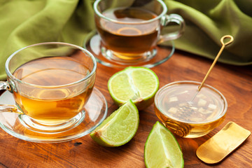 Hot refreshing citrus tea in glass close up