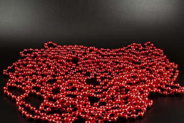 Red beads on a black background