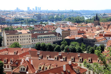 Obraz premium Classic Prague - aerial view to old roof buildings and street , Czech Republic