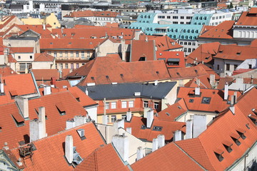 Fototapeta na wymiar Classic Prague - aerial view to old roof buildings and street , Czech Republic