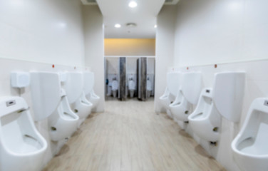 Fototapeta premium Interior bathroom blurred for background, Toilet for men.