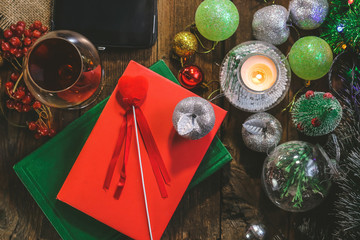 glass of wine on the background of Christmas decorations.