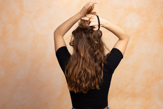 Girl With Long Hair Seen From Behind: Hair Care Concept