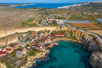 Fototapeta na wymiar Top view of famous tourist attraction Popeye village, also known as Sweethaven village. Sunny day, blue sea. Mellieha city. Malta 