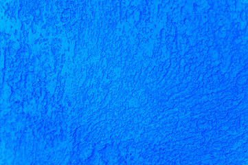 Rough texture of abstract decorative dark classic blue background of plaster wall. color 2020