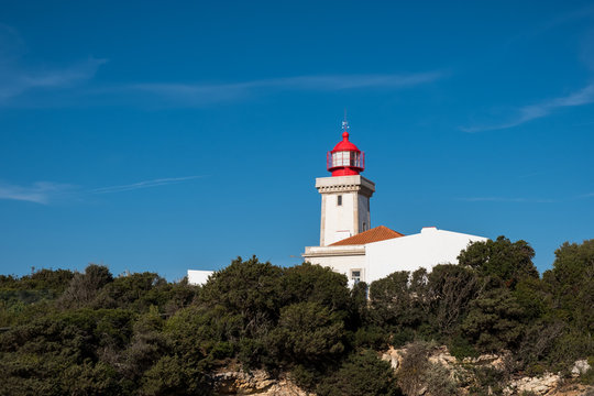 Alfanzina Lighthouse at southern coast of Portugal, Algarve, Portugal