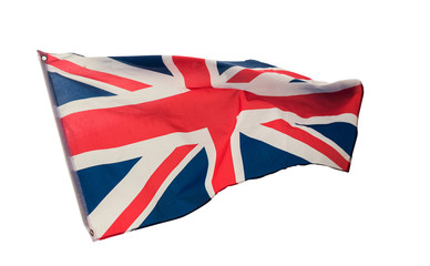 A vintage retro british union jack flag blowing in the wind, cutout and isolated against a white background. imperial red and blue flag.