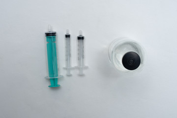 plastic syringes with push head made of thermoplastic elastomer with injection solution on a white...
