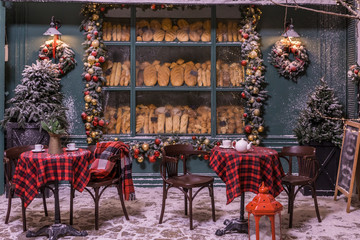 Bakery Street cafe. winter and snow. Christmas decorations. checkered plaid on a chair