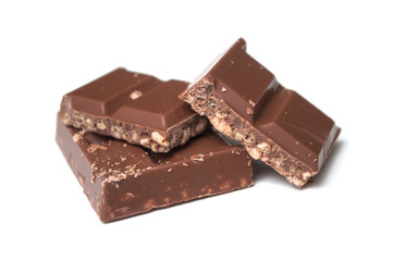 closeup of milk puffed rice chocolate blocks on white background