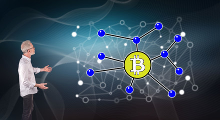 A bitcoin concept explained by a businessman on a wall screen