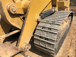 Close up of crawler bulldozer truck. Earthmoving heavy machinery